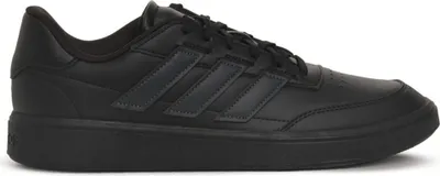 A black Adidas sneaker is shown from the side against a white background.