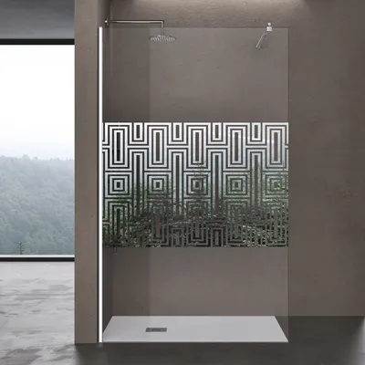 A modern bathroom with a walk-in shower featuring a glass panel with a geometric pattern.