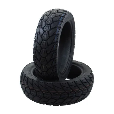 Two tires are stacked on a white background.