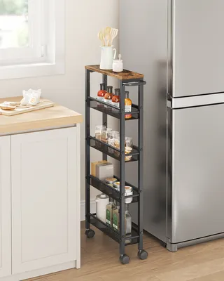 A narrow rolling cart filled with kitchen items is placed next to a refrigerator in a kitchen.