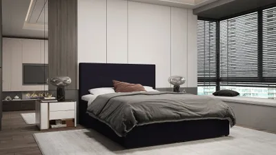 A modern bedroom with a bed, nightstand, and large window.