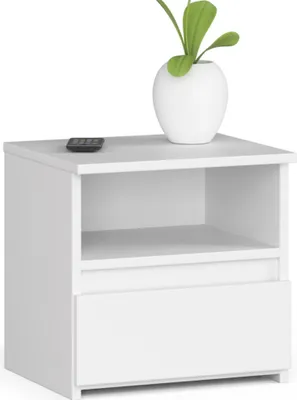 A white nightstand with a drawer and an open shelf, topped with a white vase containing a green plant and a remote control.