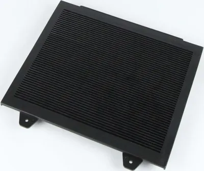 A black rectangular object with horizontal slats and mounting brackets.