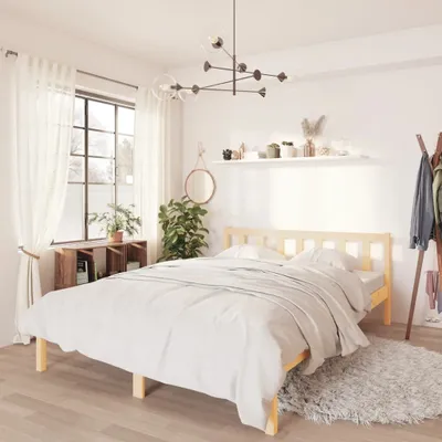 A bedroom scene with a bed, window, and decor.