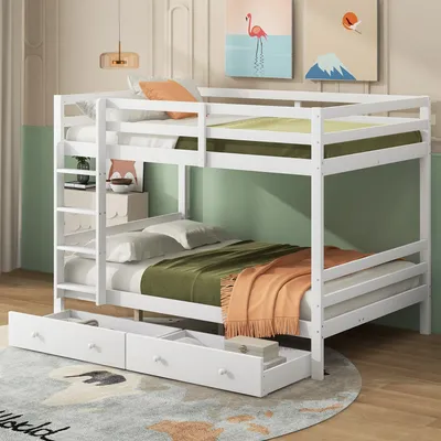 A white bunk bed with drawers underneath, set up in a room with decorative wall art and a rug.