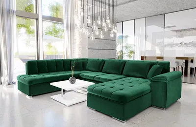 A spacious, modern living room with a large, deep green sectional sofa as the focal point.