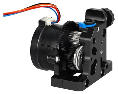 A close-up view of a 3D printer extruder with gears and a motor.