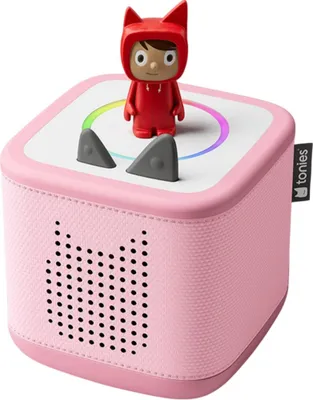 A pink Toniebox starter set with a red character figure on top.