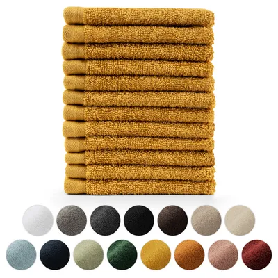A stack of mustard yellow hand towels is shown on a white background, with a row of colored circles below.