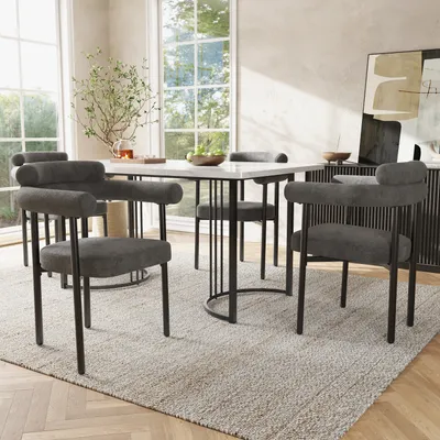 A dining set with four chairs around a table in a well-lit room.