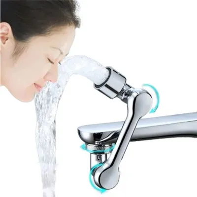 A woman is washing her face with water from a faucet that has an extension attached.