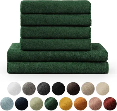 A stack of dark green towels is shown, with a row of color swatches below.