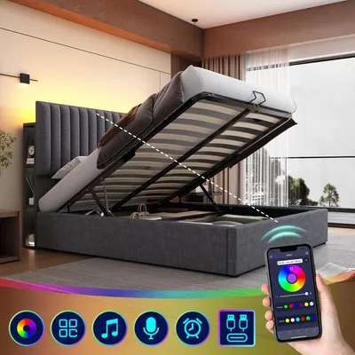 A bed with its storage compartment open, showing the mattress and frame, with a smartphone displaying a color wheel and icons in the foreground.