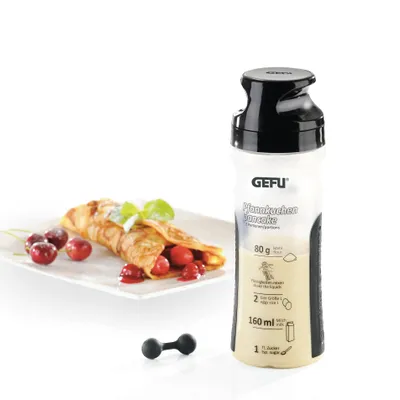 A GEFU Crêpes-SpätzleMix TWISTER is shown next to a prepared crêpe with cherries and mint.