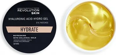 A circular black container with product information and a white bowl filled with gold hydrogel eye patches.