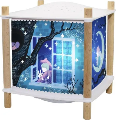 A night light lantern with a whimsical illustration of a child and a rabbit looking out a window at a starry night sky.