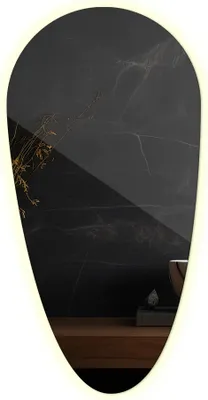A decorative mirror with a dark, marbled background and a wooden surface.