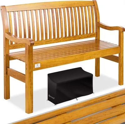 A wooden garden bench with a black cover underneath it.
