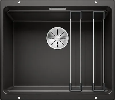 A top-down view of a dark gray kitchen sink with a silver drain.
