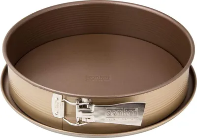 A close-up, studio shot of a round springform cake pan with a detachable base and a clamp closure.