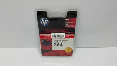 A product package for an HP ink cartridge is shown against a plain background.