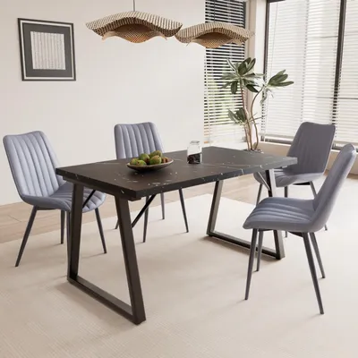 A dining room set with a table and four chairs.