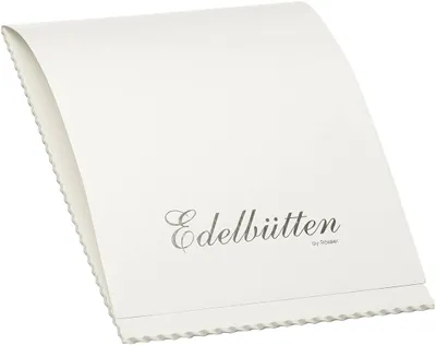 A white paper block with embossed text.