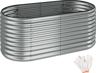 A raised garden bed made of corrugated galvanized steel, shown from a slightly elevated angle against a white background. A pair of white work gloves with orange trim is visible in the lower right corner.