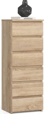 A tall, narrow chest of drawers with six drawers, made of light brown wood-effect material, is shown against a white background. A black decorative object sits on top of the chest.
