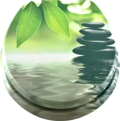 A stack of smooth, dark stones sits on rippling water, with green leaves in the background.