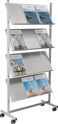 A white metal magazine rack with multiple shelves, each holding magazines. The rack is on wheels.