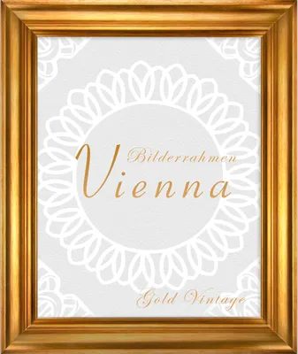 A gold vintage picture frame with decorative elements and text.