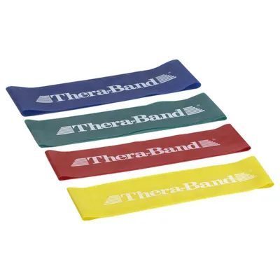 Four colored resistance bands are laid out diagonally on a white background.