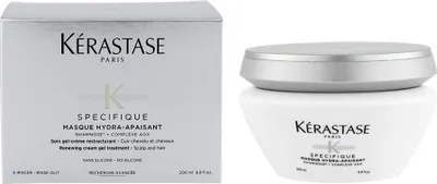 A product shot showing the packaging and the product container for a hair mask.