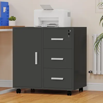A dark gray mobile office cabinet with a door and three drawers, placed on a wooden floor next to a white radiator. A white printer is on top of the cabinet.
