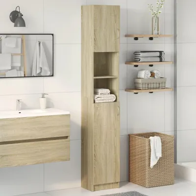 A bathroom scene with a tall cabinet, sink, mirror, shelves, and a laundry basket.