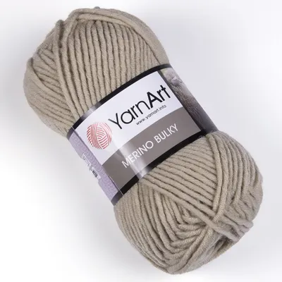 A ball of beige yarn with a label.