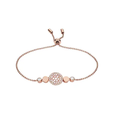 A rose gold bracelet with clear stones on a white background.