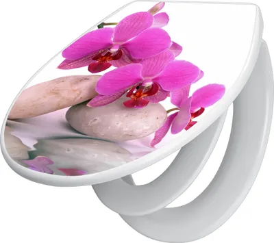 A toilet seat with a printed image of pink orchids and smooth stones.