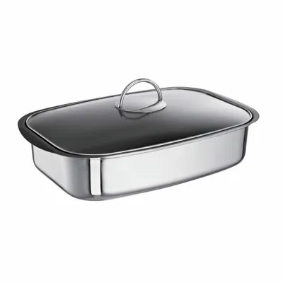 A stainless steel roasting pan with a glass lid and a metal handle, shown from a slightly elevated side angle on a white background.