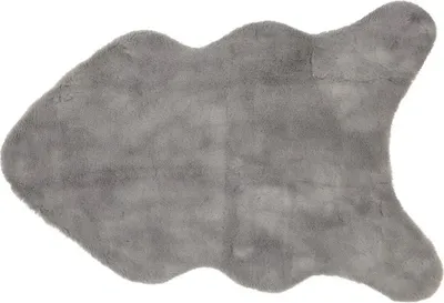 A single, irregularly shaped, grey faux fur rug is shown against a white background.