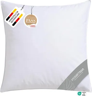 A white pillow with tags attached.