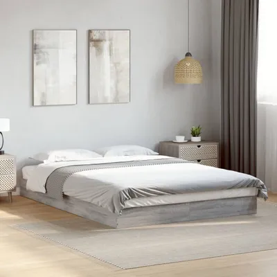 A bedroom scene with a bed, nightstands, and artwork on the wall.