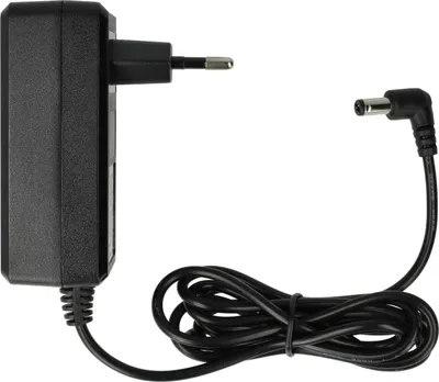 A black power adapter with a European plug and a coiled cable with a DC barrel connector.