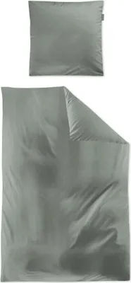 A folded duvet cover and a pillowcase, both in a sage green color, are laid out on a white background.
