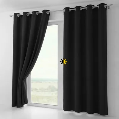 A black curtain is shown hanging on a window rod, partially covering a window.