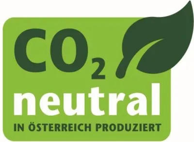 A green badge with text indicating CO2 neutrality and production in Austria, accompanied by a leaf icon.