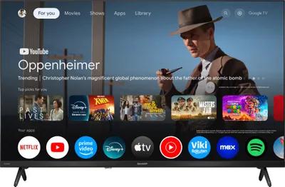 A television screen displaying a smart TV interface with movie posters and app icons.