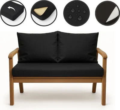 A black cushion set for a garden sofa, shown on a wooden bench.