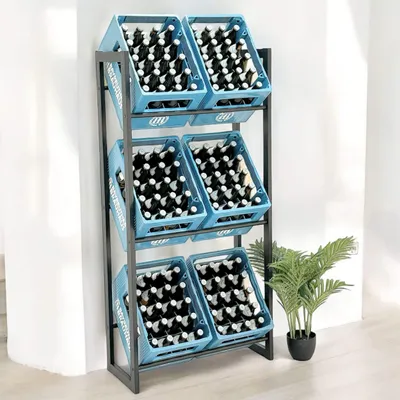 A metal shelving unit filled with blue crates containing bottles, standing against a wall with a plant to the side.